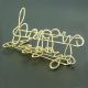 "happy" shaped paper clips, gold paper clips, decorative paper clips