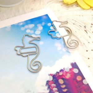 fish shaped paper clips in seahorse outline