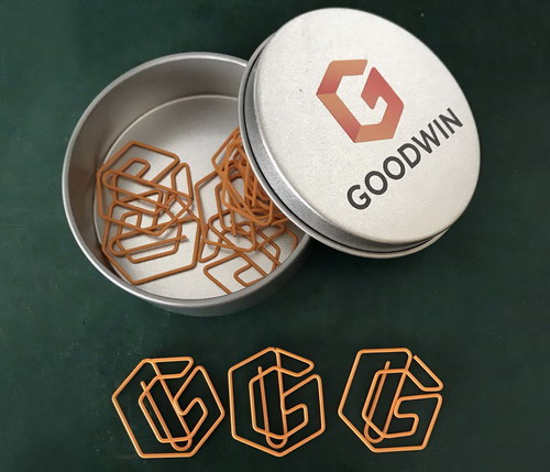 logo shaped paper clips in a tin